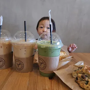 a little girl sitting at a table