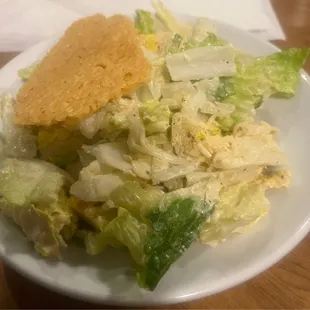 Caesar Salad with homemade croutons and a Parmesan crisp cracker.