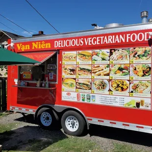 a food truck with a menu on the side