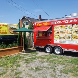 Food truck In the front yard of house.