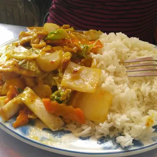 Chicken with spicy garlic sauce with white rice.