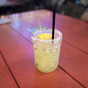 a drink in a plastic cup with a straw