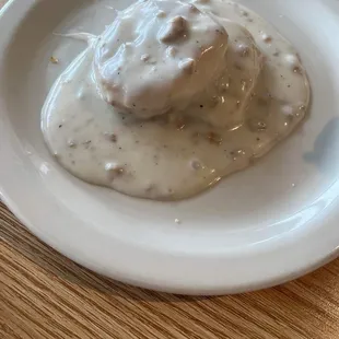 Very small; grill cooked frozen biscuit, not fresh or good, bland gravy.