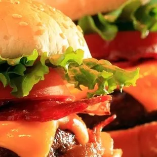 a cheeseburger with bacon and lettuce