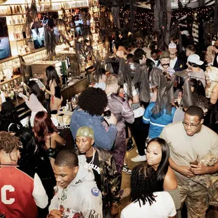 a crowd of people at a bar