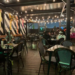 The covered patio of the bar. The