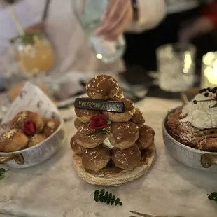 The dessert trio. The beignets (crème brûlée) pain au chocolate bread pudding, caramel cream puffs