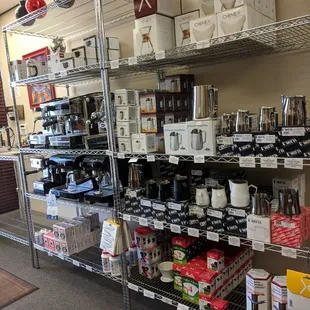 Inside coffee shop tons of different coffee gadgets to purchase.