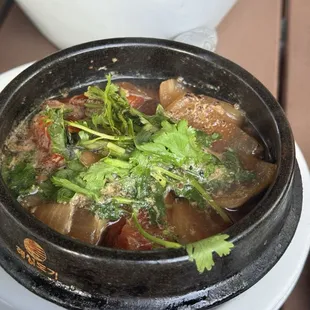 Atlantic salmon stewed in claypot with peppercorn and tomato concassé, shallots, and cilantro!