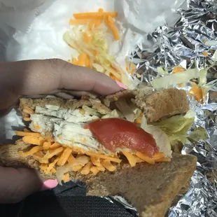 The poorly done turkey sandwhich.... shredded cheddar, tomato wedges, and the missing avacado I paid $2 extra for.