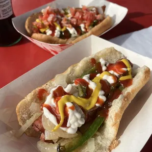 bacon wrapped hot dog w/ everything on it