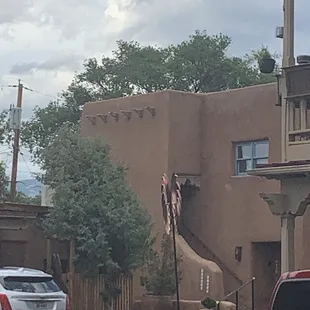 a red truck parked in front of a building