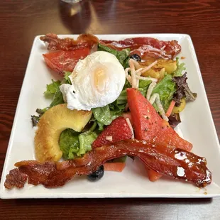 Vanessie Salad grilled watermelon, pineapple, berries, chile bacon and poach egg