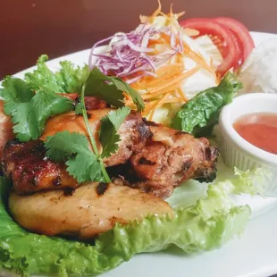 BBQ Chicken: Grilled marinated bone-in chicken; served with spicy sweet &amp; sour sauce.