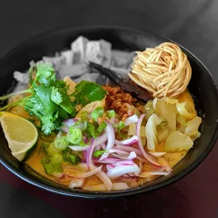 Kao Soi; Egg noodle in curry broth. A spin off from the famous northern Thai dish.