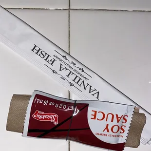 Cute bundle of a napkin, a soy sauce packet, and some chopsticks ~ Presentation is swell