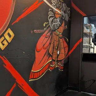 a mural of a samurai