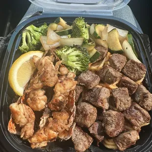 Lobster &amp; Steak with half fried rice and half noodles and veggies.