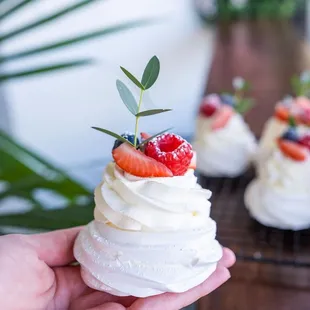 Pavlova meringue with cream and berries
