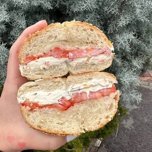 Sesame seed bagel with veggie cream cheese and tomato