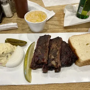 Pork ribs plate with chipotle cream corn and potato salad $14