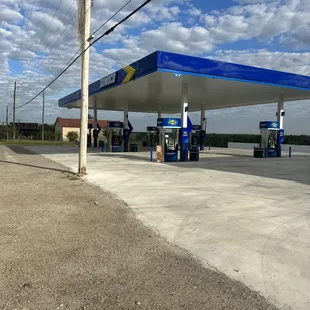 a blue and white gas station