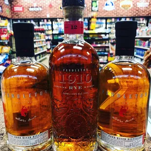 three bottles of liquor