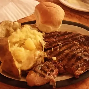 14oz Ribeye (half eaten) w/ baked potato