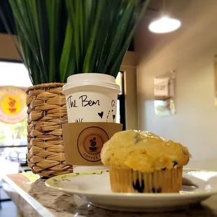 a cup of coffee and a muffin