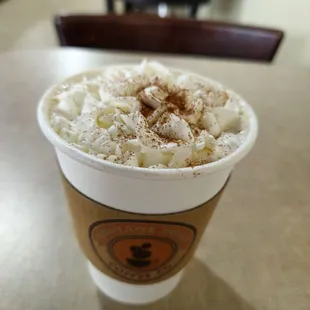 a cup of coffee with whipped topping