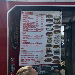 a woman looking at a menu