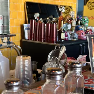 a bar with a variety of condiments