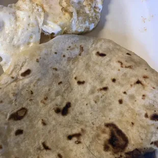 Hair on bottom of tortilla, eggs not over-easy