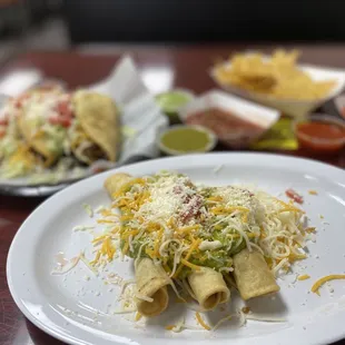 Three rolled tacos, two crispy shredded beef tacos. Awesomeness on a plate.