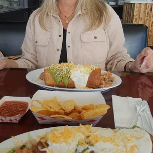 My Hottie wife, shredded chicken Chimi and carnitas Chimi.