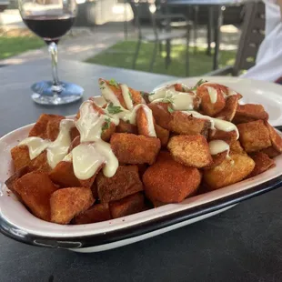 a plate of food and a glass of wine