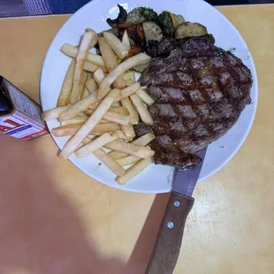 Ribeye steak with fries