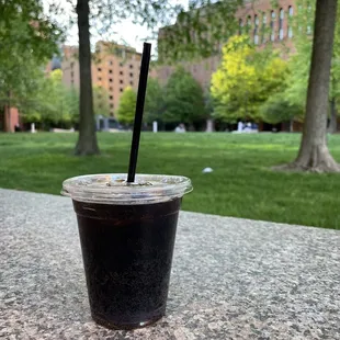 a cold drink in a plastic cup