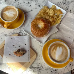 Parmesan bagel with cream cheese, lavender latte, and chocolate croissant