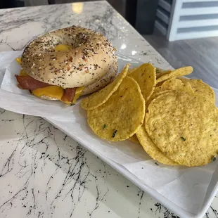 Bacon, Egg and Cheese bagel with side of chips