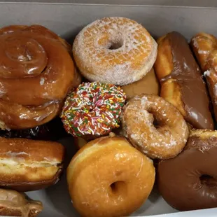 a variety of doughnuts in a box