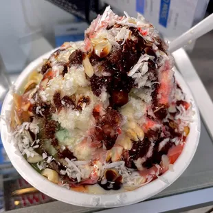 Half Strawberry half Rajbhog Indian Ice Gola with vanilla ice cream.