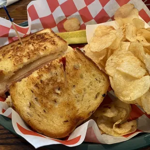a sandwich and chips on a plate