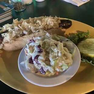 Johnsonville Brat with sauerkraut and cole slaw