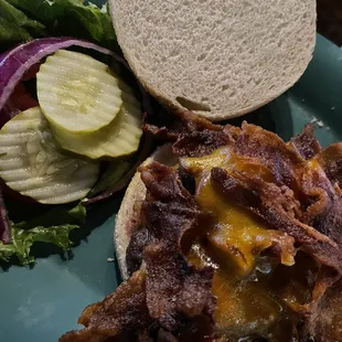 Burger with a half pound of bacon on top!
