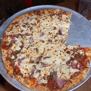 Meat lovers Roman Coin pizza. Thinner pub-style crust. Tasty.