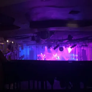 a stage with purple lighting