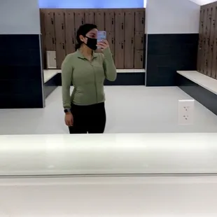 a gym selfie with a peak at the womens locker room.