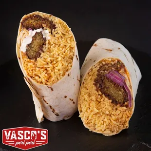 Veg Roll
Options of chipotle bean patty, paneer, or falafel in either a plain or spinach wrap;Vasco&apos;s rice, red onions,chili&amp; garlic sauce