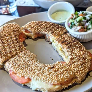 Panini toast with cheese, eggs, mushrooms, and tomatoes